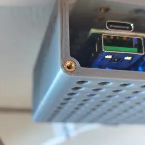 Press M2 heat‑set inserts into the four bosses on the cover