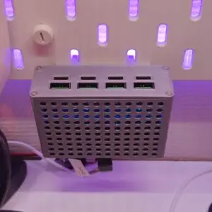 The KixTips Fast Charger Hub mounted on an Ikea Skadis pegboard. Skadis Mount.stl